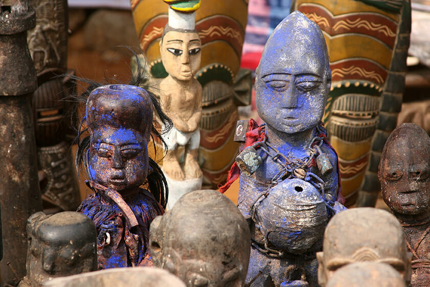 The traditional African handcrafted wooden statuettes during annual Beninese Voodoo festival, next to Ouidah, Benin