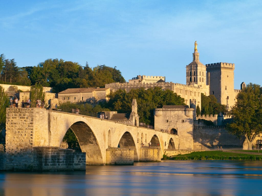 Avignon Bridge with Popes Palace and Rhone river at sunset, Pont Saint Benezet, Provence, France