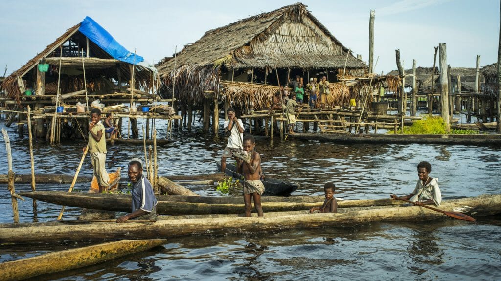 Children on boats, True North Boat, Admiralty Islands, Papua New Guinea