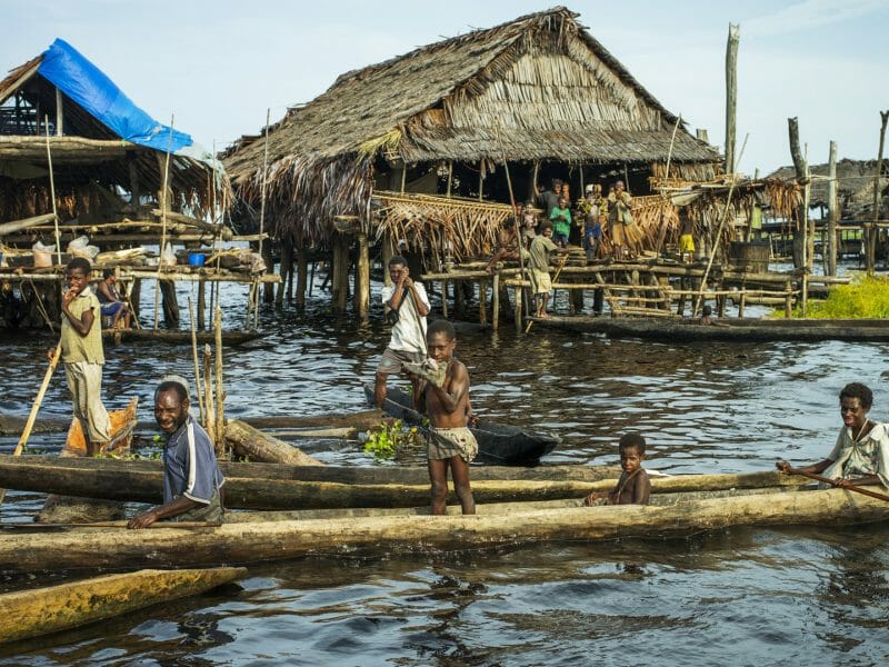 Children on boats, True North Boat, Admiralty Islands, Papua New Guinea
