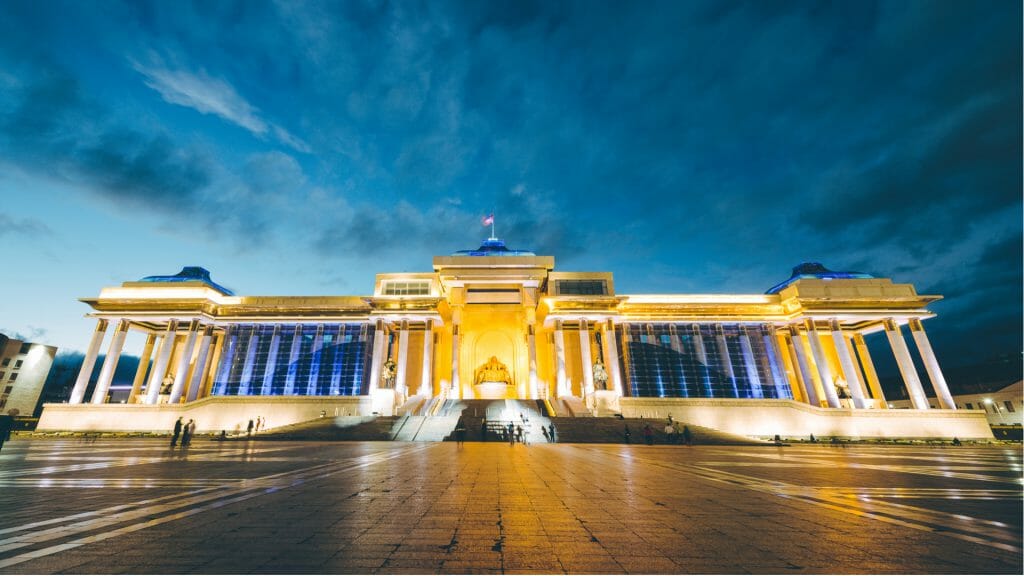 Evening view from Chinggis Square towards government palace which is lit in the early evening light
