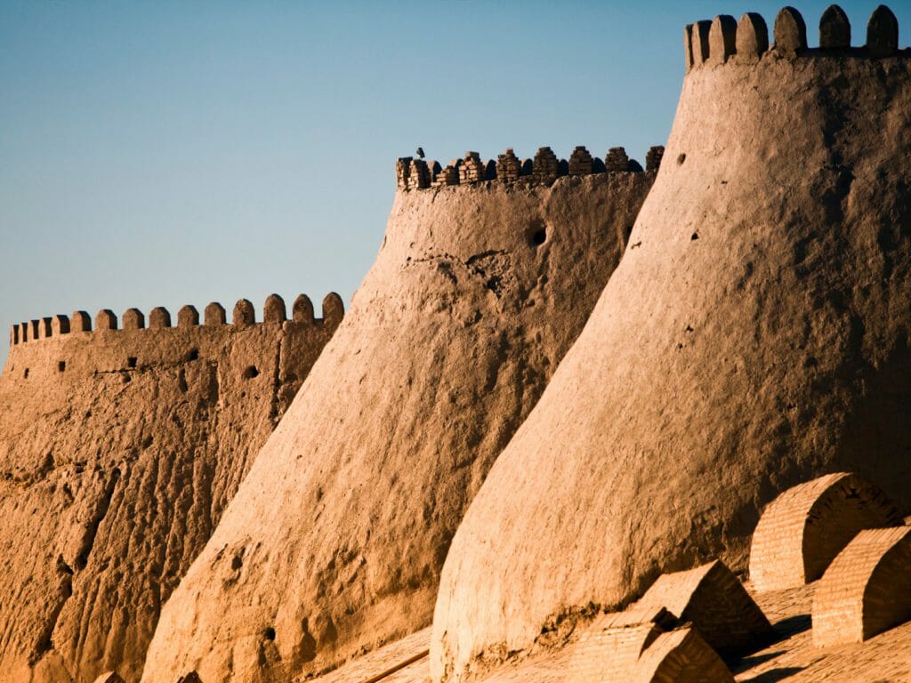 Curved mud brick walls and ramparts of  Khiva ancient city walls.