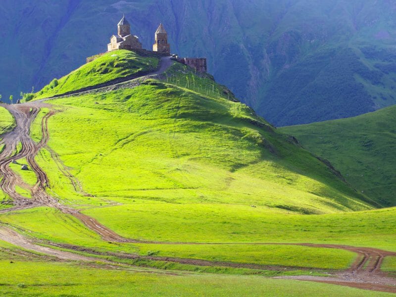 Green Sameba Trinity Church, Gergeti Village, Kazbegi, Georgia