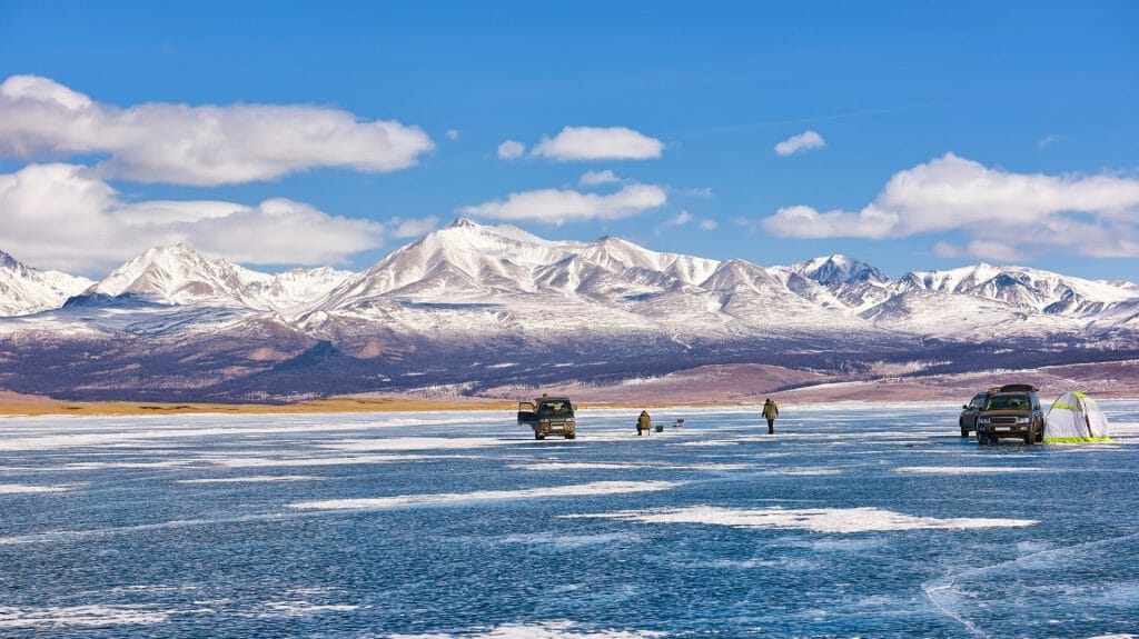 Ice fishing on Lake Hovsgol in winter, Hovsgol, Mongolia