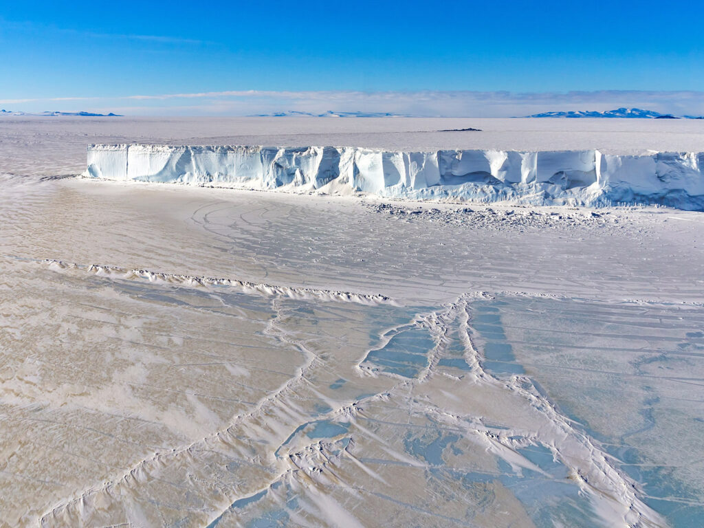 Iceberg frozen in sea ice in the Ross Sea, Antaractica