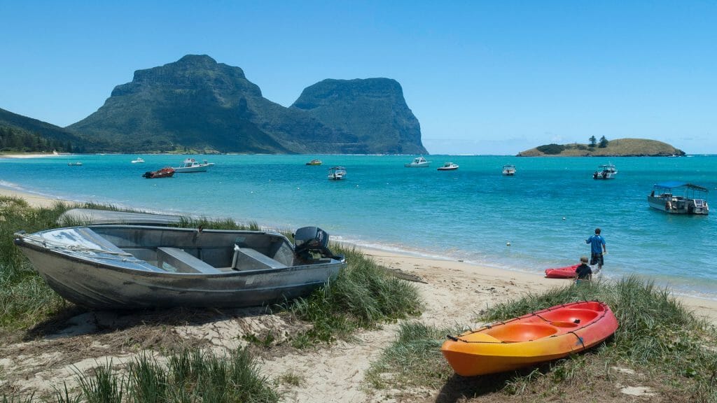 View across the lagoon to Mounts Gower and Lidgbird on Lord Howe Island, New South Wales, Australia. Kayak in foreground