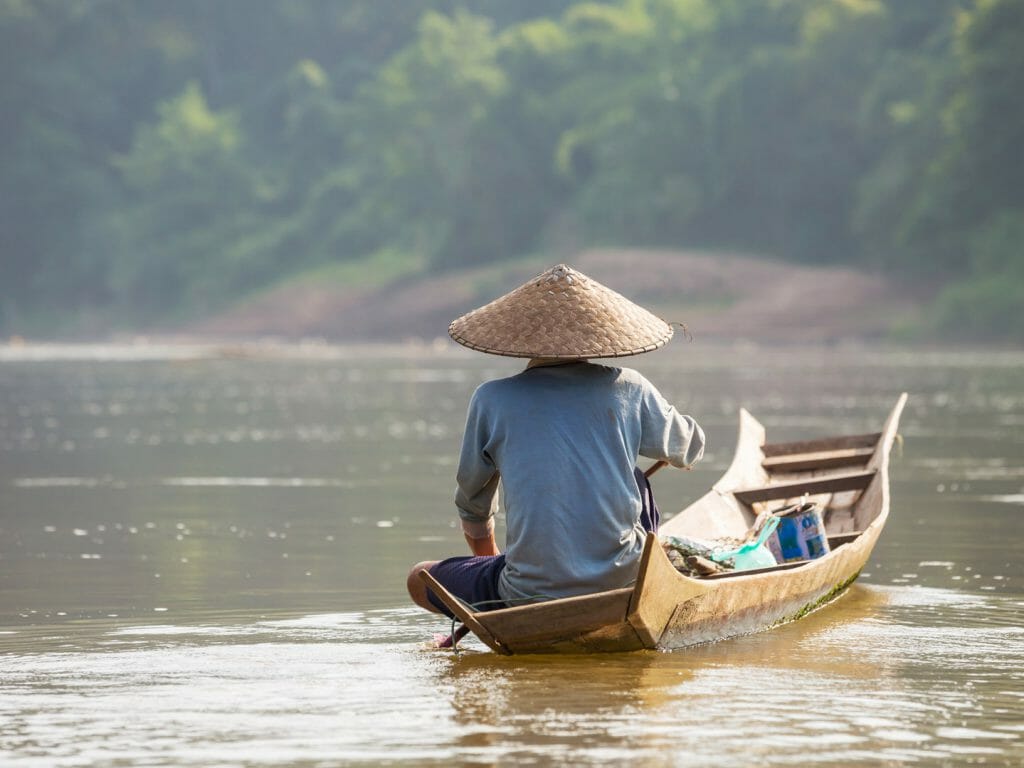 Man on river boat, Luang Prabang, Laos