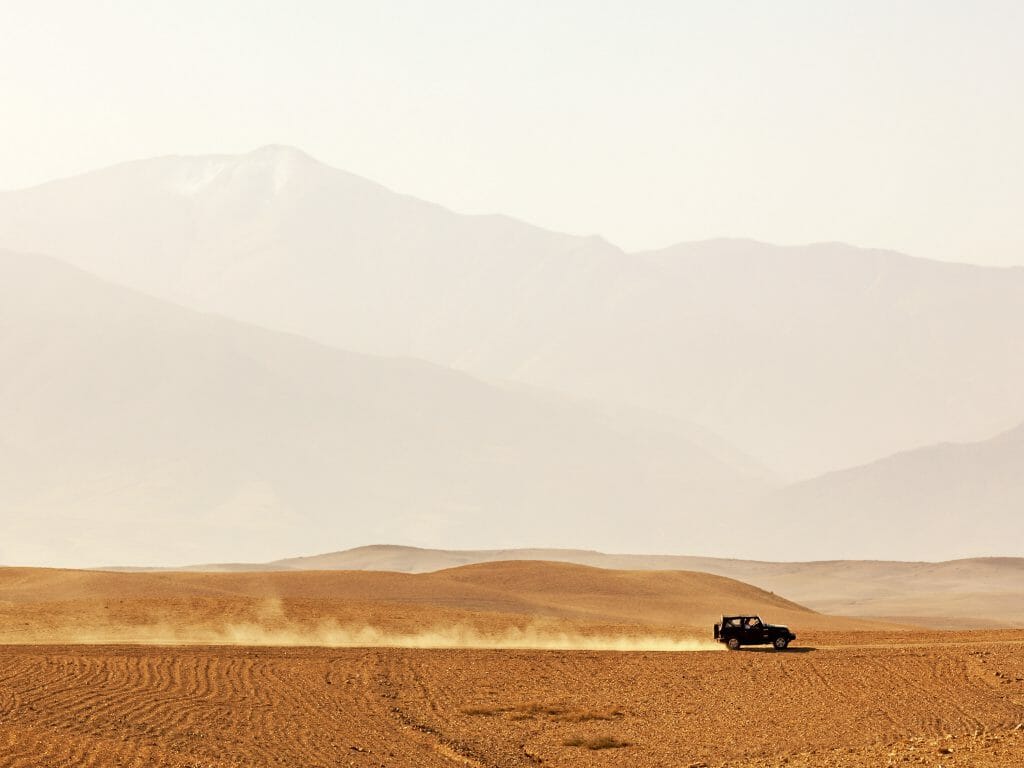 Off-road vehicle driving through Agafay desert, Morocco