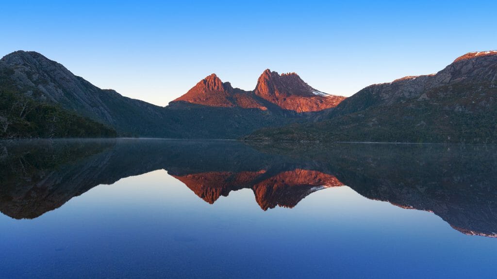 Cradle Mountain landscape reflected in lake Dove, Cradle Mountain National Park, Tasmania, Australia