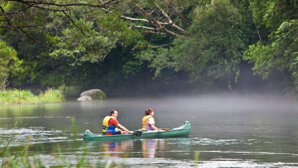 Two people in a canoe on the Mossman River in the Daintree