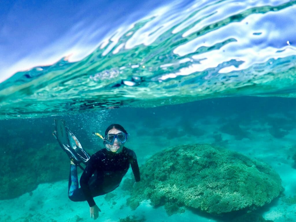 Underwater shot of snorkeller on Ningaloo Reef.