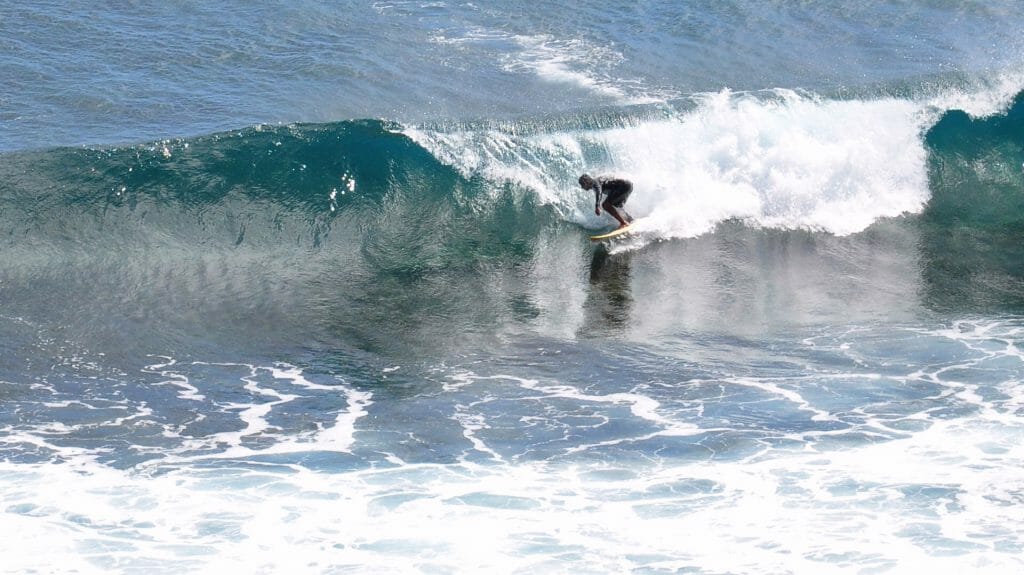Surfer at Boldros Beach, Fernando de Noronha, Brazil