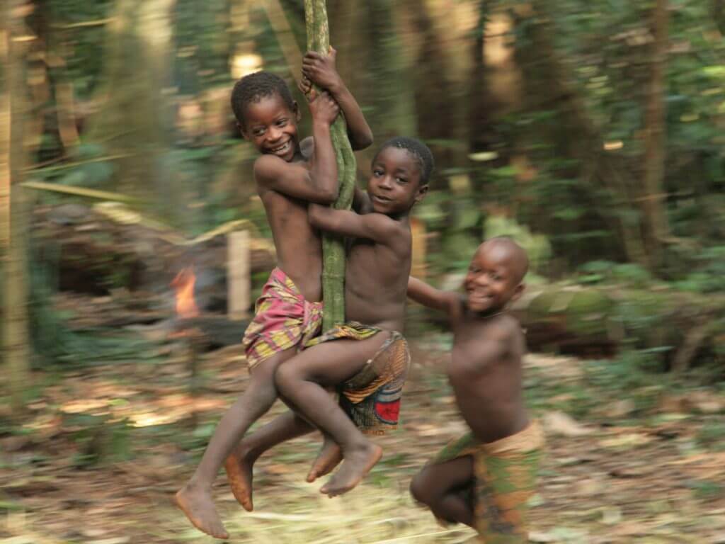 Kids swinging on vine, Cameroon