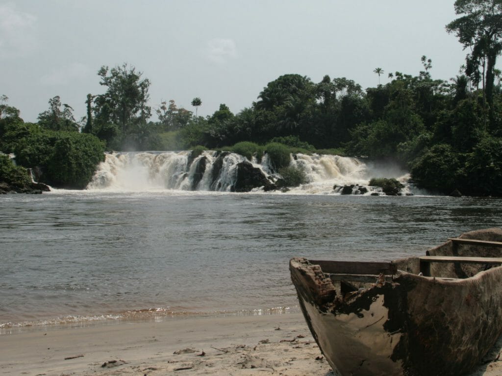 Lobe Falls and boat, Kribi, Cameroon