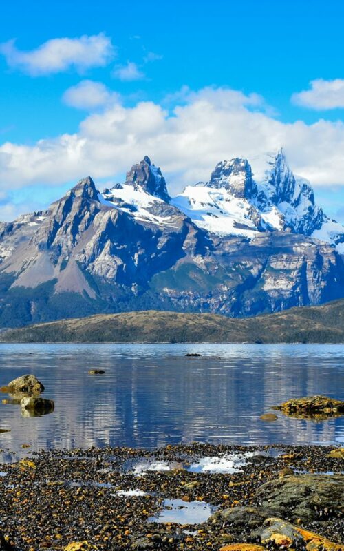 View across water to Darwin Range of mountains, Australis Cruise, Fjords of Tierra del Fuego, Patagonia