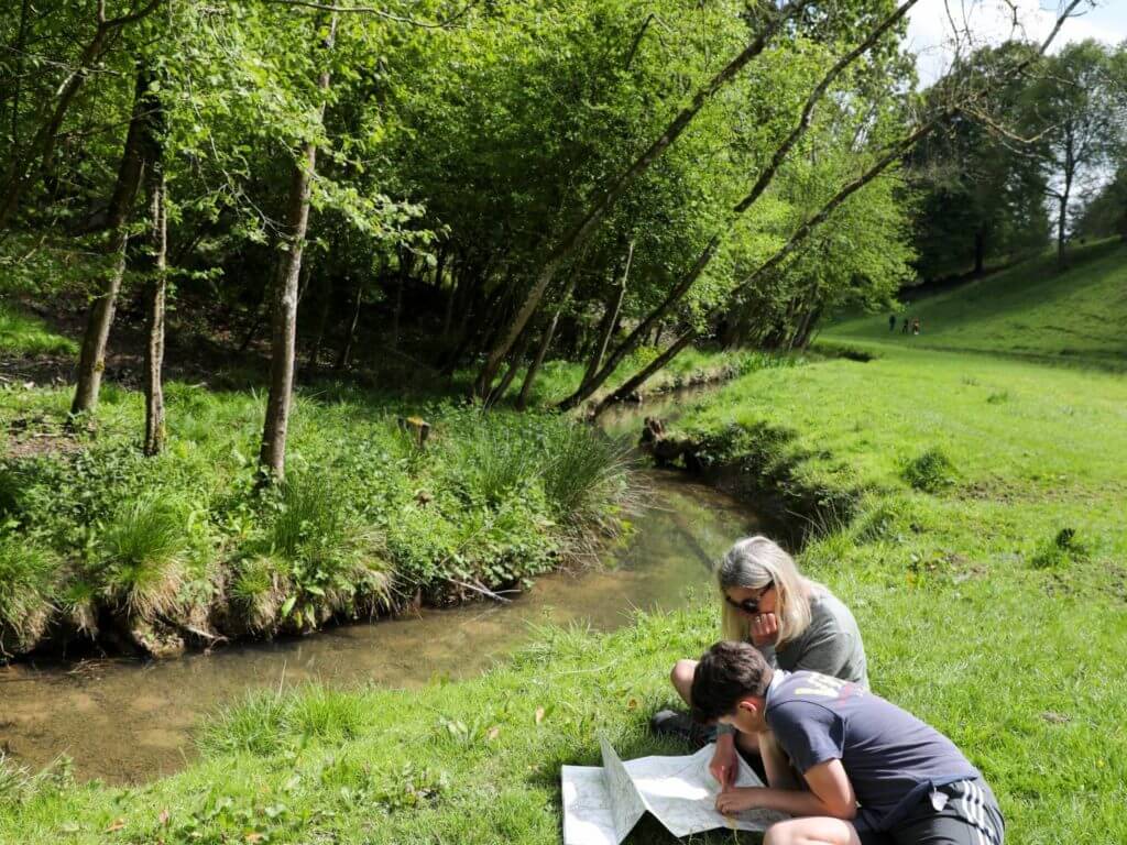 Map reading near Edgeworth, Cotswolds, England, UK