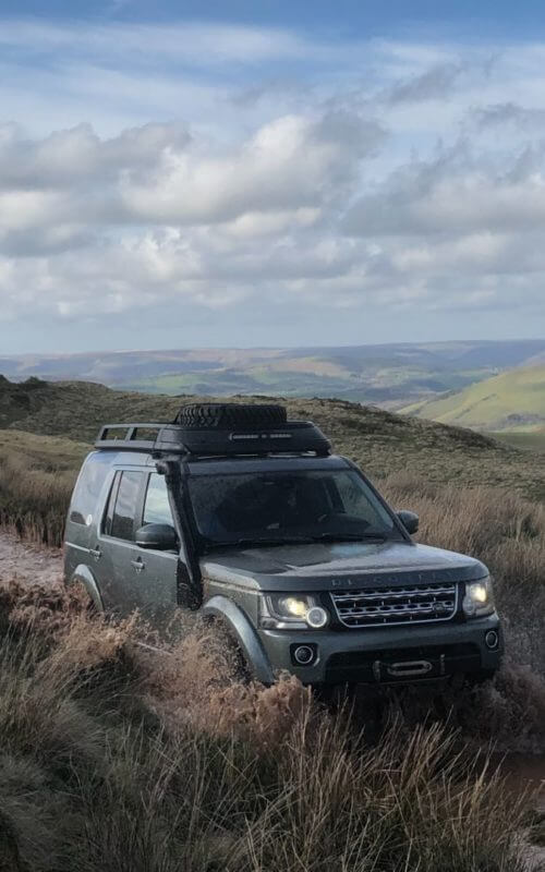 Land Rover on moorland track, Wales