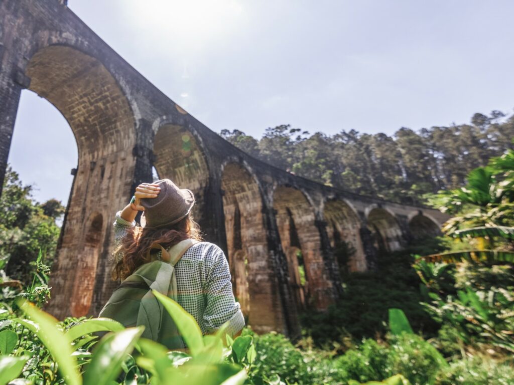 Woman looking at Demodara nine arches bridge, Tea Country, Sri Lanka