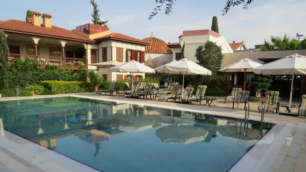 Ruin Adalia Hotel, Pool with umbrellas, Antalya, Turkey
