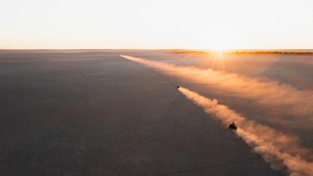 Quad biking across Makgadikgadi pans, Kalahari, Botswana