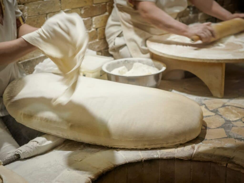 Women making lavash flatbread