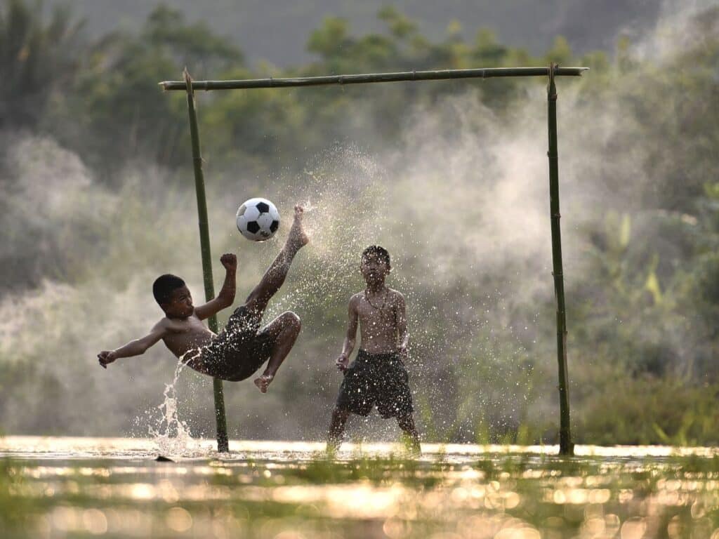 Boys Playing Football in Thailand