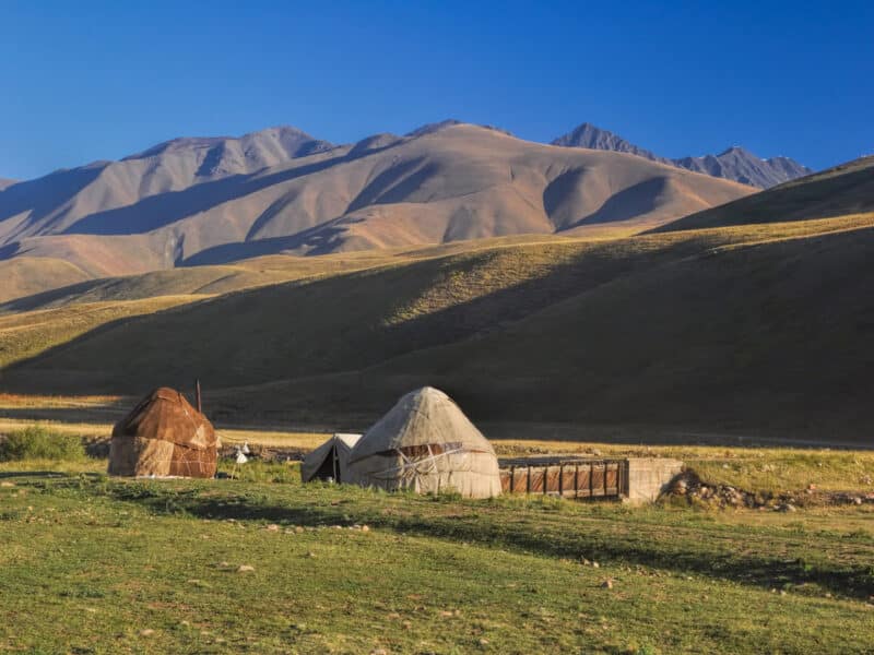 Traditional yurts on green grasslands, Altyn Arashan, Kyrgyzstan