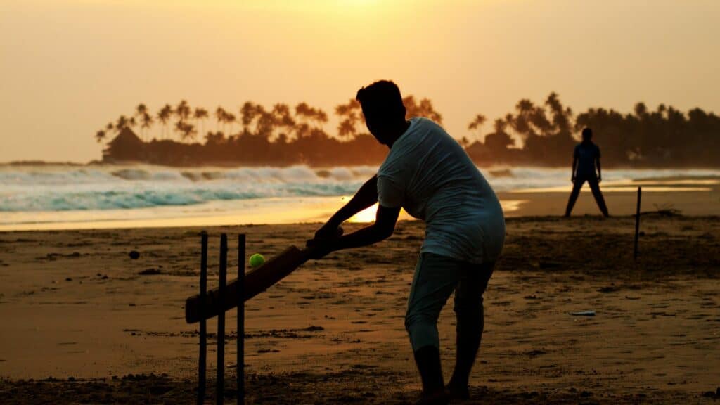 Cricket on beach at sunset, Sri Lanka