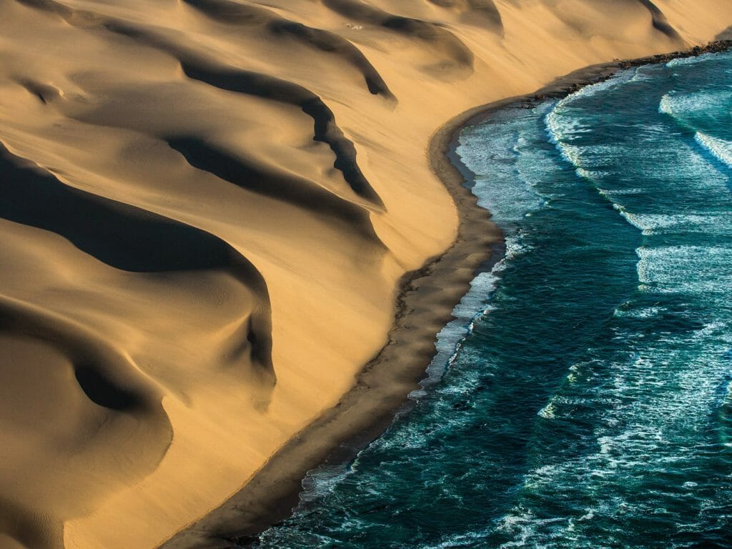 Dunes and ocean from the air, Skeleton Coast, Namibia