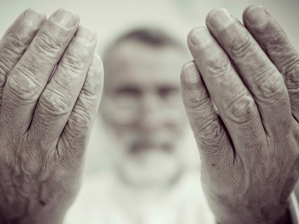 Elderly man praying, Saudi Arabia
