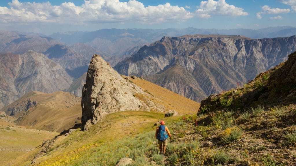 Person Hiking through the Chimgan Mountain landscape in Uzbekistan