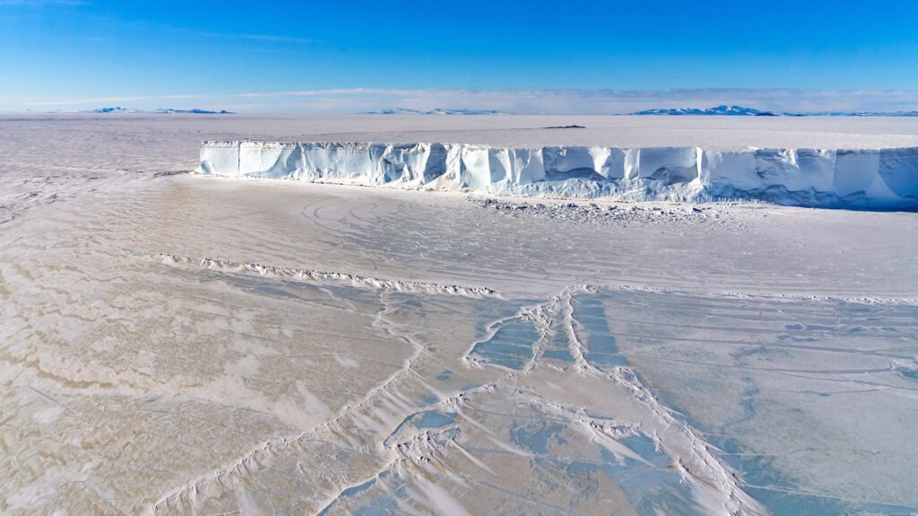 Iceberg frozen in sea ice in the Ross Sea, Antaractica