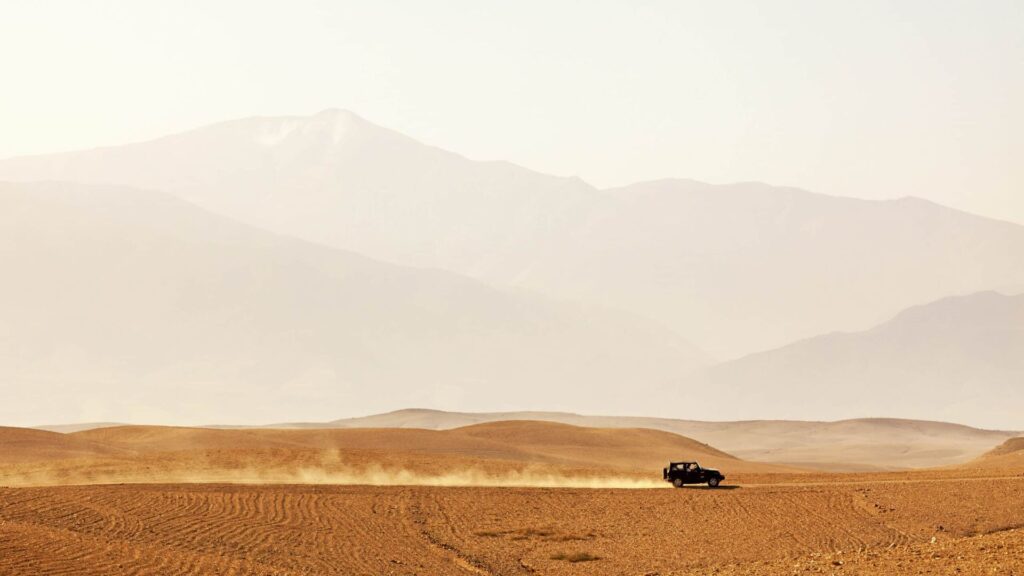 Off-road vehicle driving through Agafay desert, Morocco