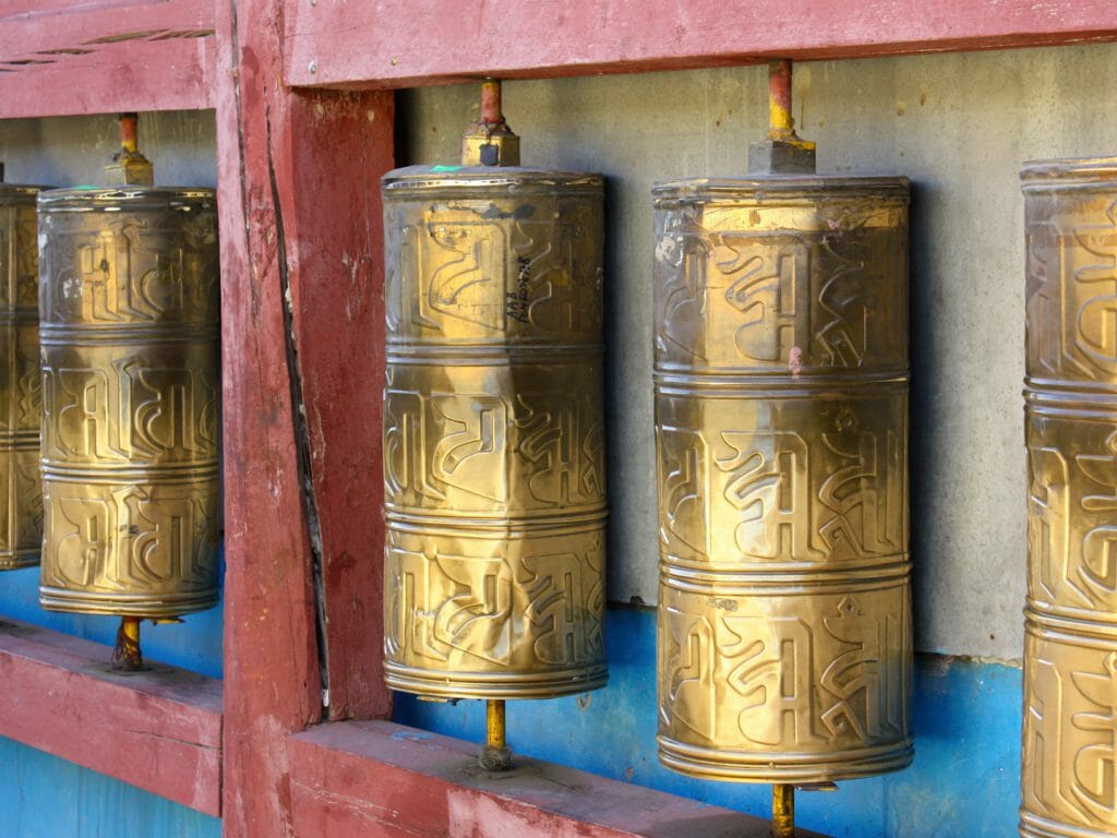 Row of buddhist prayer wheels in Gandan Monastery, Ulaanbaatar, Mongolia