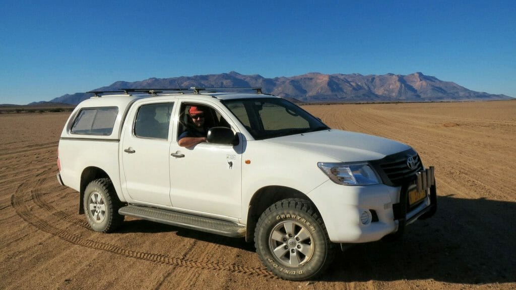 Self drive in front of Brandberg Mountain, Damaraland, Namibia