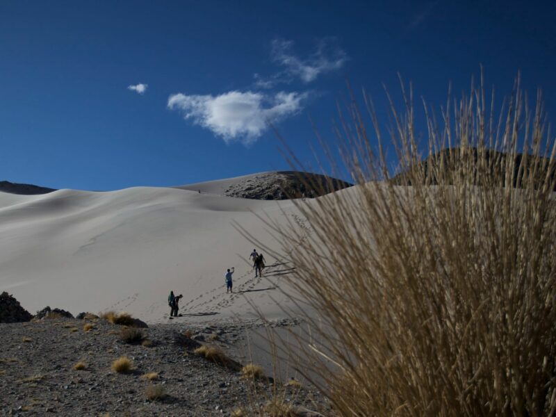 View of people climbing sand dune, North west Argentina