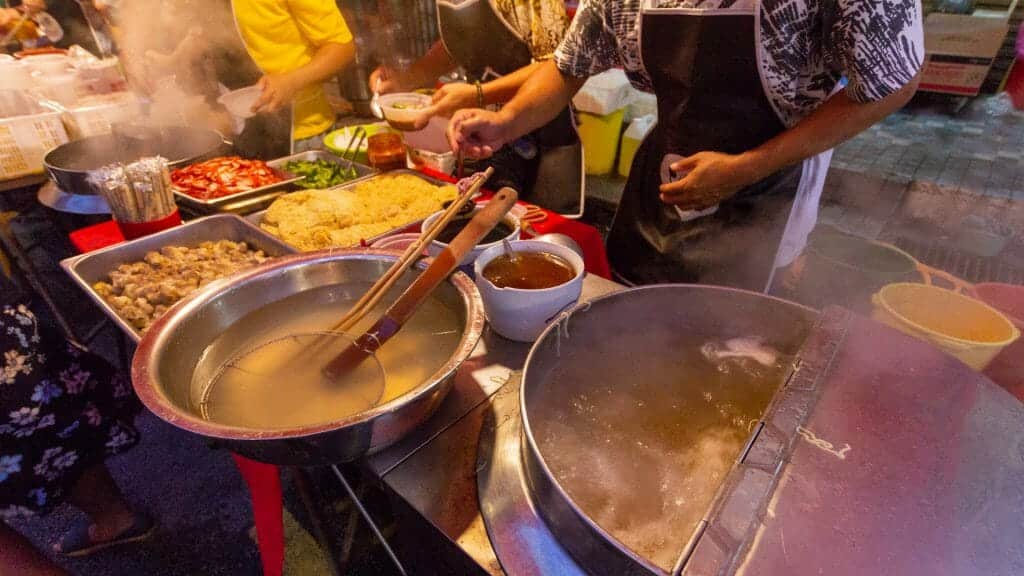 Streetfood stall cooking local cuisine at night market