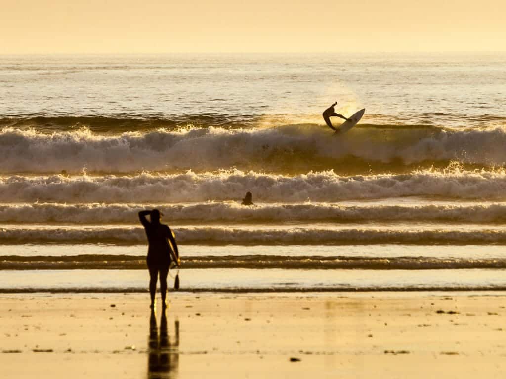 Surfer on the beach in Tofino