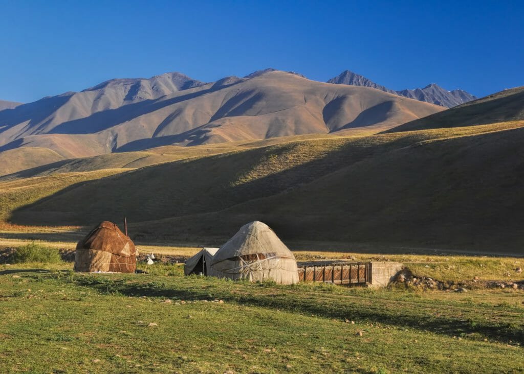 Traditional yurts on green grasslands, Altyn Arashan, Kyrgyzstan