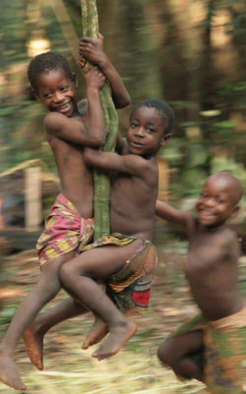 Kids swinging on vine, Cameroon