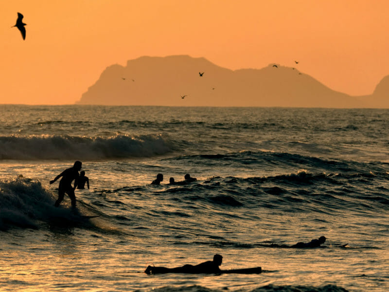 Scenic Sunset, Surfer Silhouettes, Seagulls, Pacific Ocean, Lima, Peru