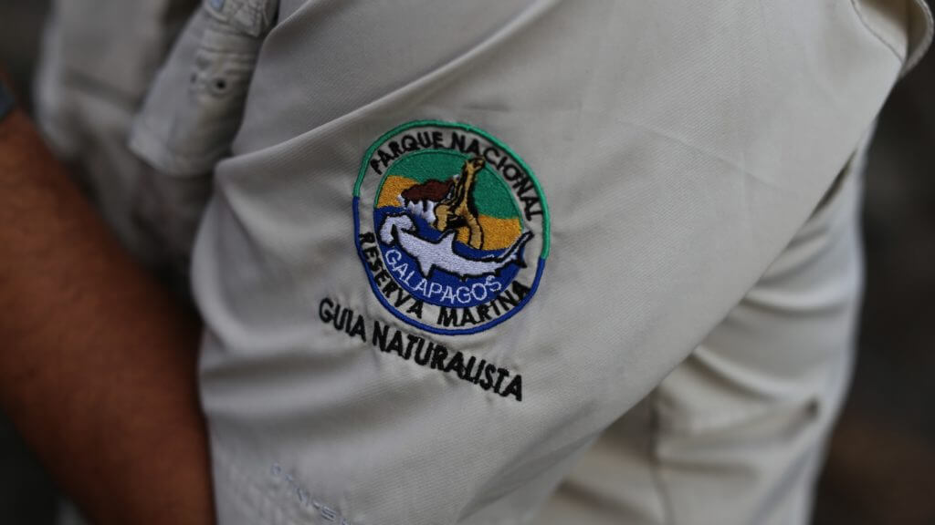 A close up photograph of the embroidered National Park badge of a guide in the Galapagos Islands
