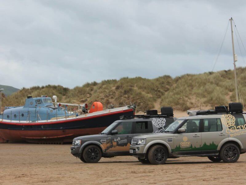 Land Rovers on beach, Wales