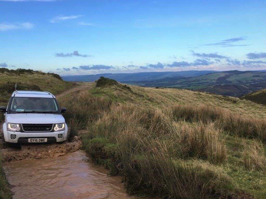 Land Rover on moorland track, Wales