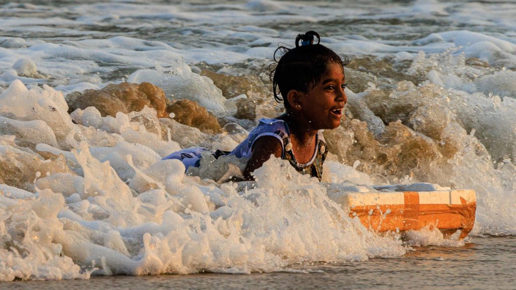 Child in sea, Tangalle, Sri Lanka
