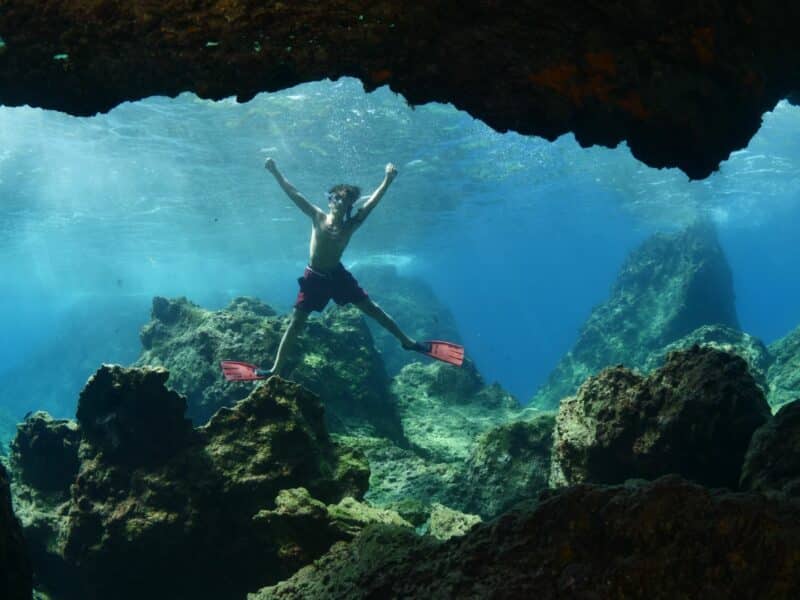 Boy cave snorkelling, Red Sea, Egypt